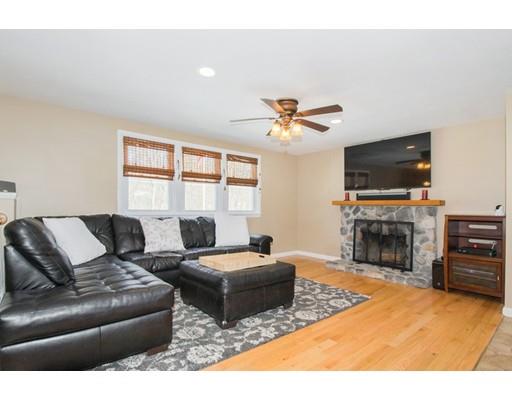 38 Old Bolton Road Hudson, MA 01749 - Photo 8 of 30 a living room with fireplace furniture and a flat screen tv