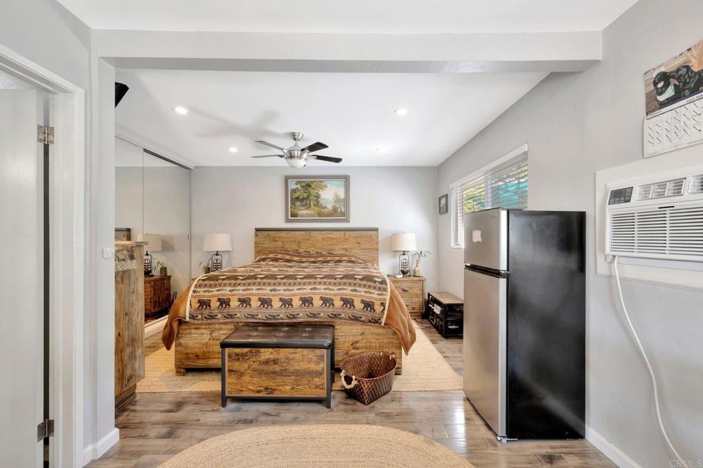 1601 Pepper Drive El Cajon, CA 92021 - Photo 14 of 31 a bedroom with a bed and a refrigerator