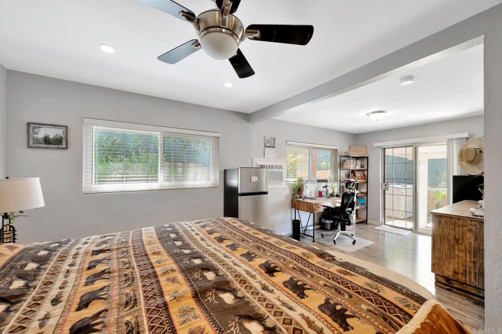 1601 Pepper Drive El Cajon, CA 92021 - Photo 15 of 31 a bedroom with a bed and wooden floor