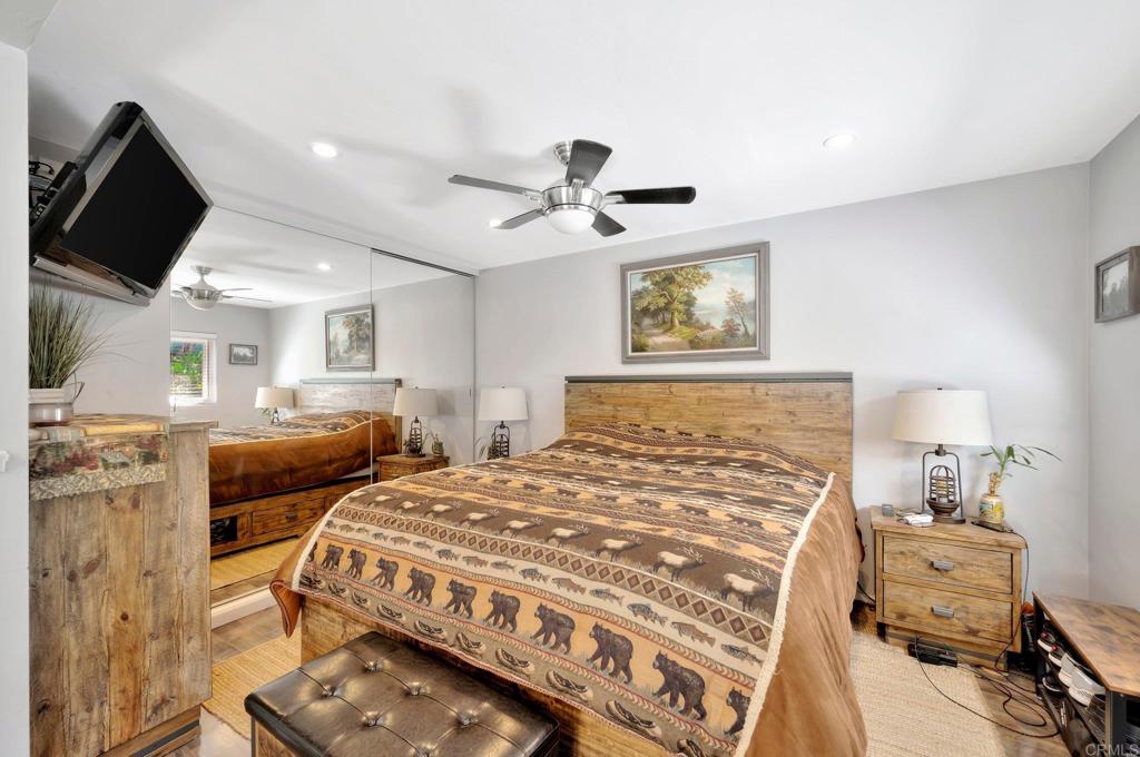 1601 Pepper Drive El Cajon, CA 92021 - Photo 16 of 31 a bedroom with a bed and a chandelier