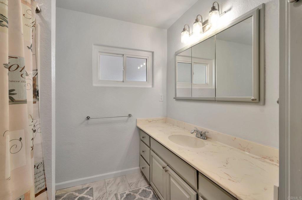 1601 Pepper Drive El Cajon, CA 92021 - Photo 18 of 31 a bathroom with a sink double vanity and a mirror