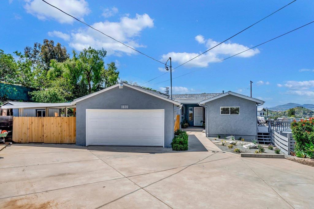1601 Pepper Drive El Cajon, CA 92021 - Photo 3 of 31 a front view of a house with a garden