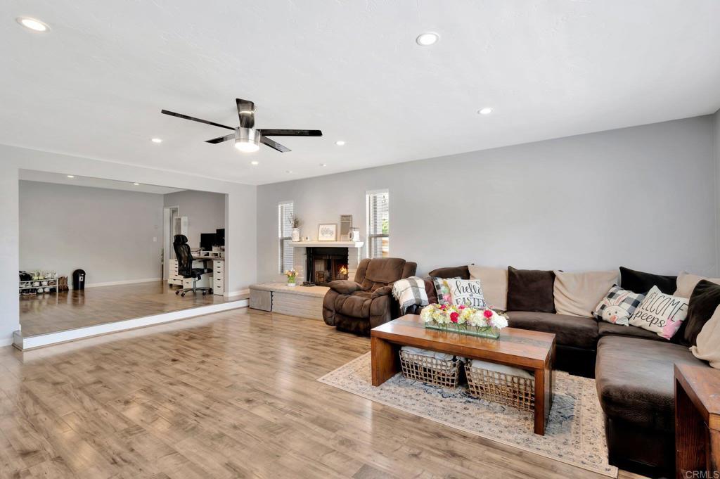 1601 Pepper Drive El Cajon, CA 92021 - Photo 7 of 31 a living room with furniture and a dining table with wooden floor