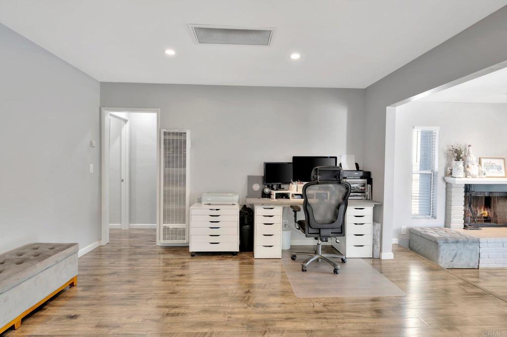 1601 Pepper Drive El Cajon, CA 92021 - Photo 9 of 31 a view of a workspace with furniture and a bedroom