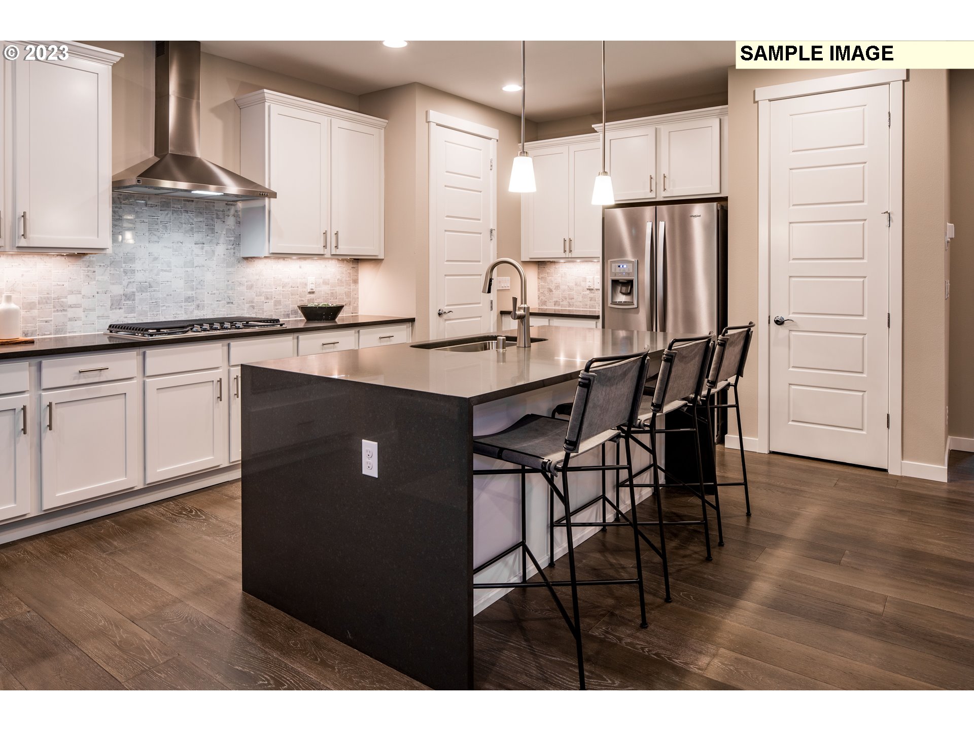 358 South 87th Avenue Ridgefield, WA 98642 - Photo 7 of 27 a kitchen with stainless steel appliances granite countertop a dining table chairs refrigerator and sink