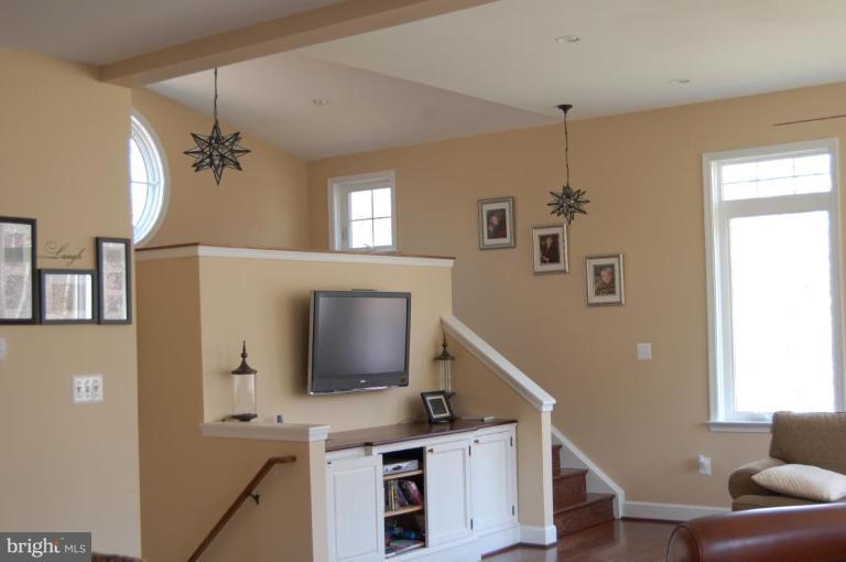 6017 Colchester Road Fairfax, VA 22030 - Photo 2 of 23 Family Room with stairs to loft and mudroom