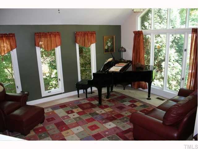 2008 Petworth Court Raleigh, NC 27615 - Photo 2 of 12 Wonderful large formal living room with fireplace and beautiful views out of every window.