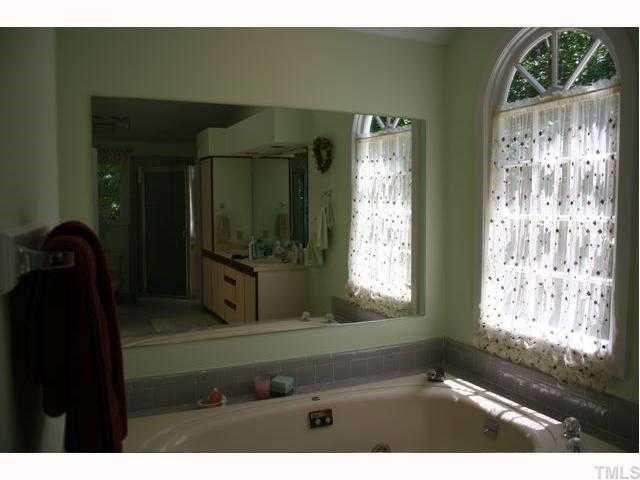 2008 Petworth Court Raleigh, NC 27615 - Photo 9 of 12 Huge master bath with spa tub, separate shower and double sinks.