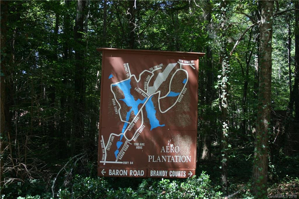 906 Woods Loop Waxhaw, NC 28173 - Photo 2 of 11 a sign that is on a pole