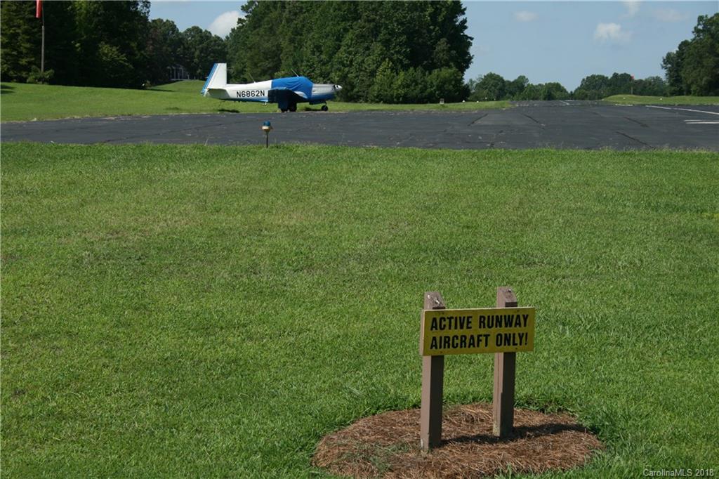 906 Woods Loop Waxhaw, NC 28173 - Photo 9 of 11 a backyard of a house with lots of green space