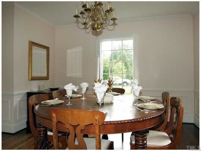 2539 Wake Drive Raleigh, NC 27608 - Photo 4 of 12 FORMAL DINING ROOM BOASTS HARDWOOD FLOORS AND EXTENSIVE TRIMWORK.