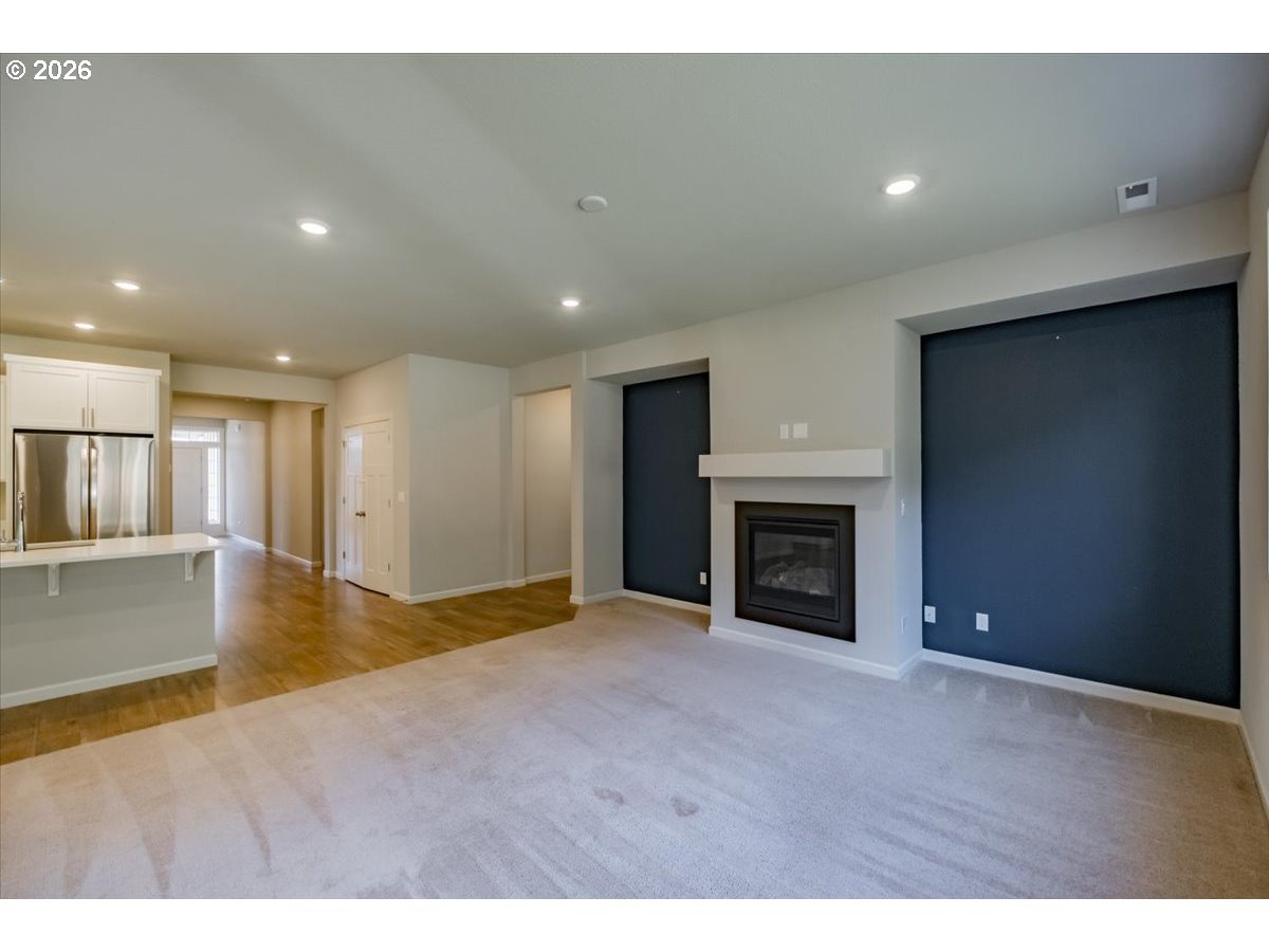 315 Cypress Street Mount Angel, OR 97362 - Photo 17 of 43 a view of an empty room with a fireplace