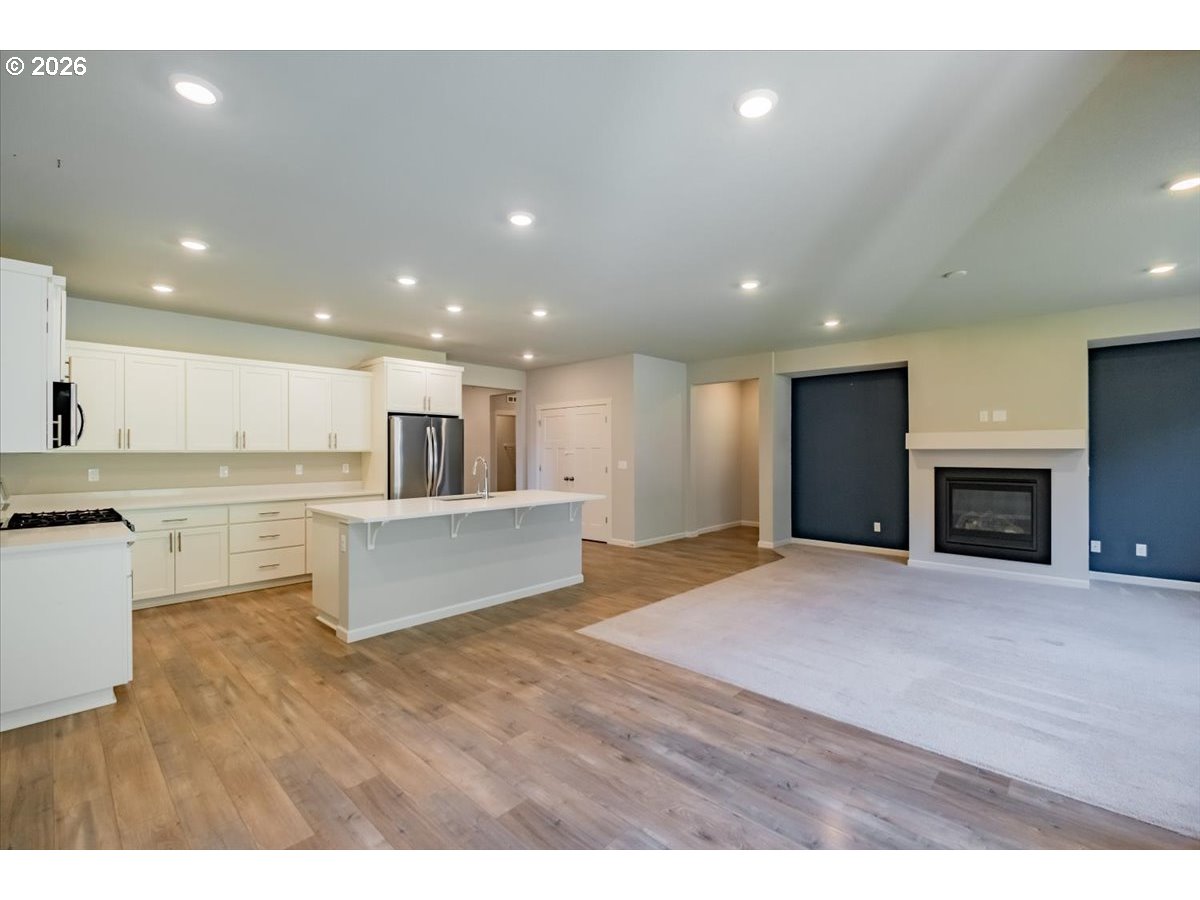 315 Cypress Street Mount Angel, OR 97362 - Photo 20 of 43 a view of kitchen with granite countertop refrigerator oven and white cabinets