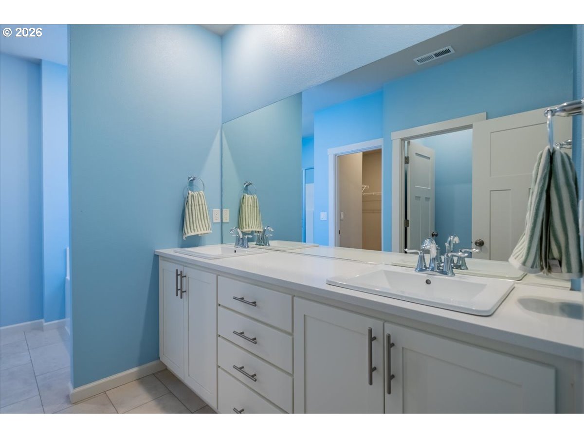 315 Cypress Street Mount Angel, OR 97362 - Photo 25 of 43 a bathroom with a sink and a mirror