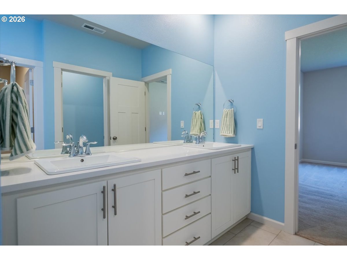 315 Cypress Street Mount Angel, OR 97362 - Photo 26 of 43 a bathroom with a sink and a mirror