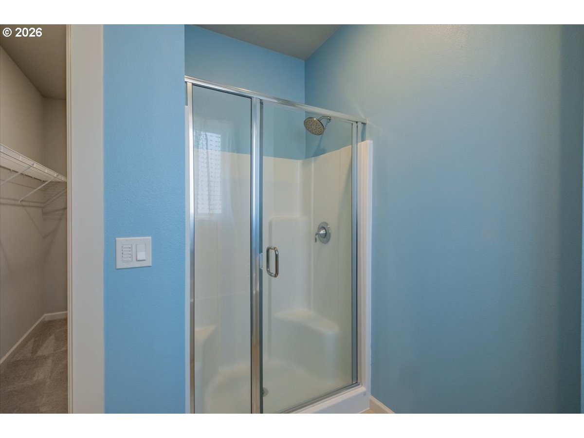 315 Cypress Street Mount Angel, OR 97362 - Photo 28 of 43 a bathroom with a glass shower door