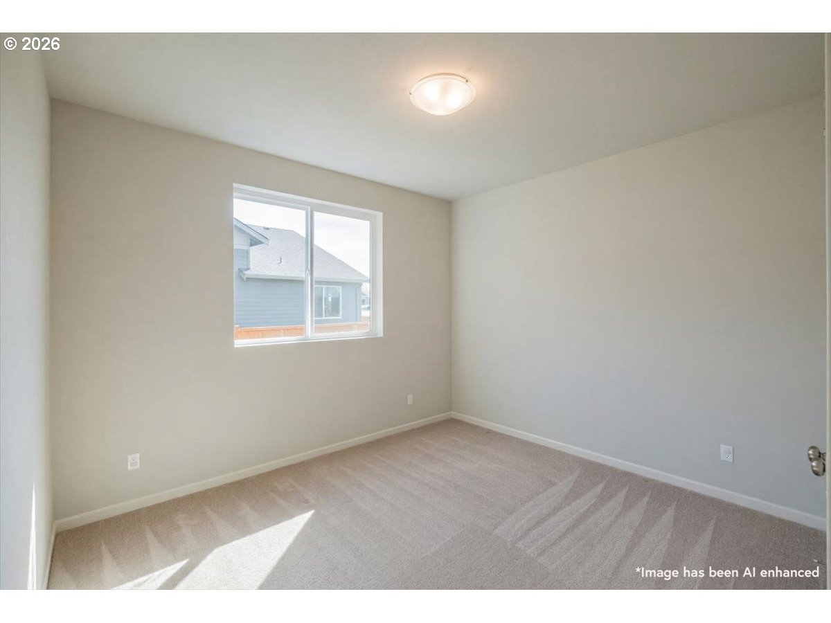 315 Cypress Street Mount Angel, OR 97362 - Photo 30 of 43 an empty room with wooden floor and windows