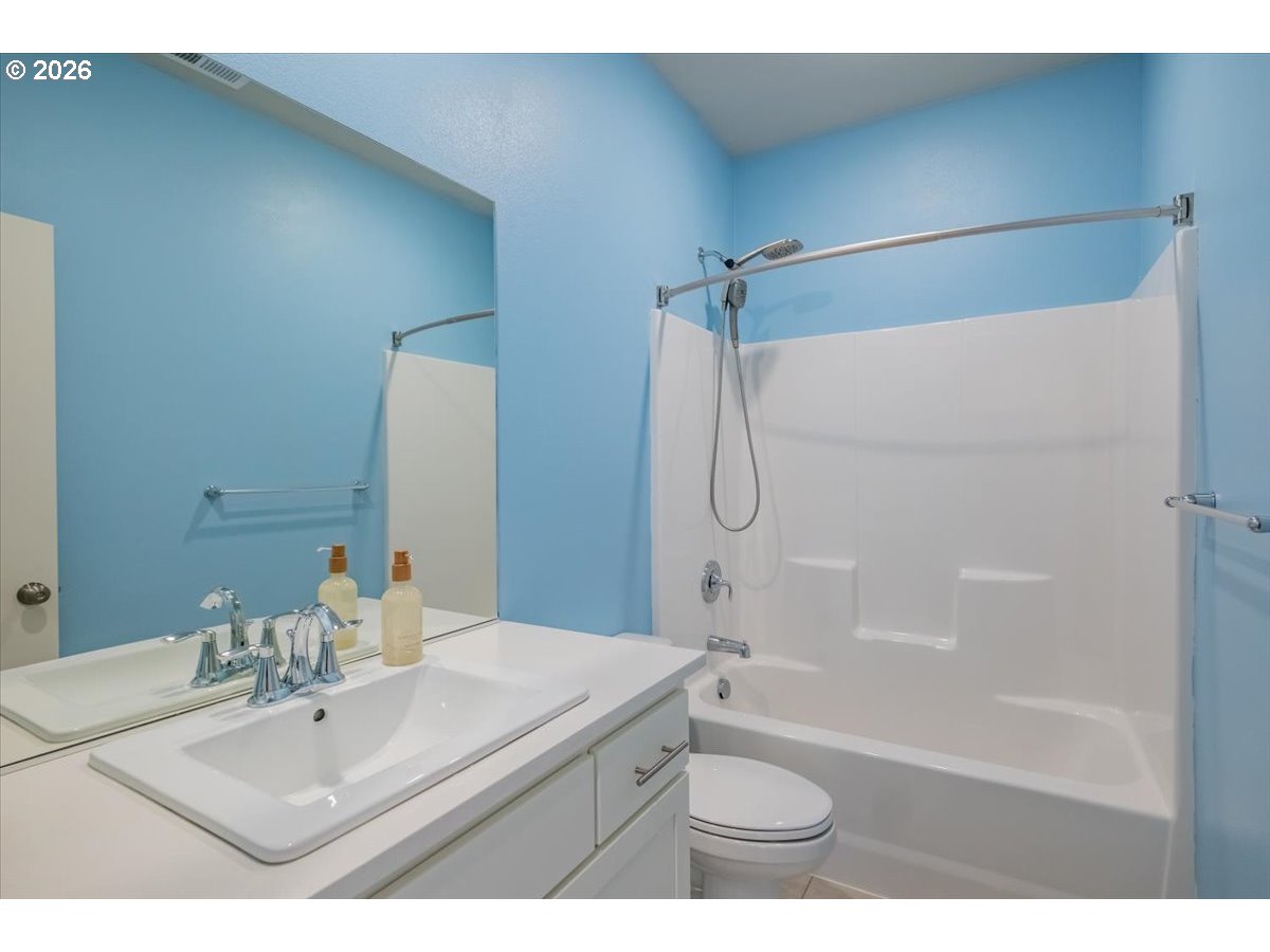 315 Cypress Street Mount Angel, OR 97362 - Photo 32 of 43 a bathroom with a sink a toilet and shower