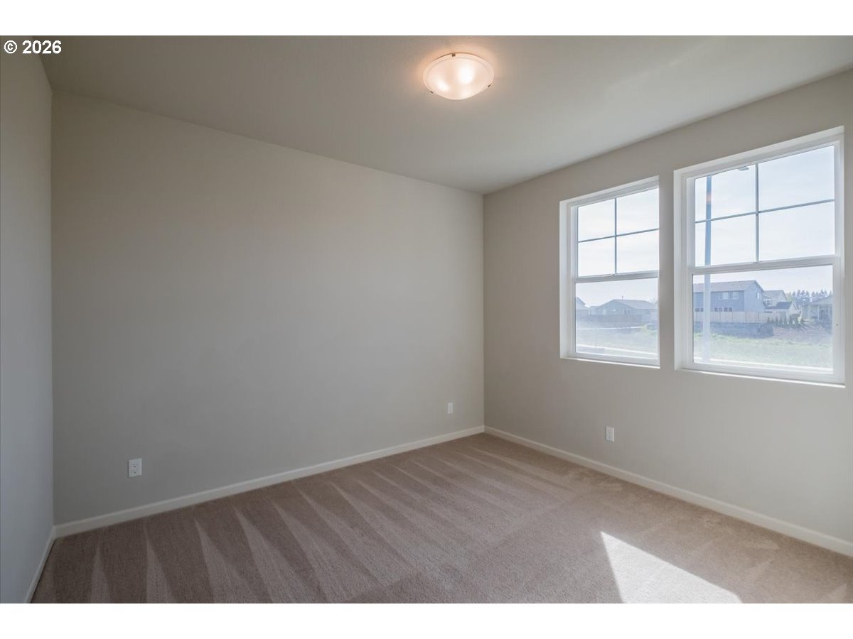 315 Cypress Street Mount Angel, OR 97362 - Photo 37 of 43 a view of an empty room with wooden floor and a window