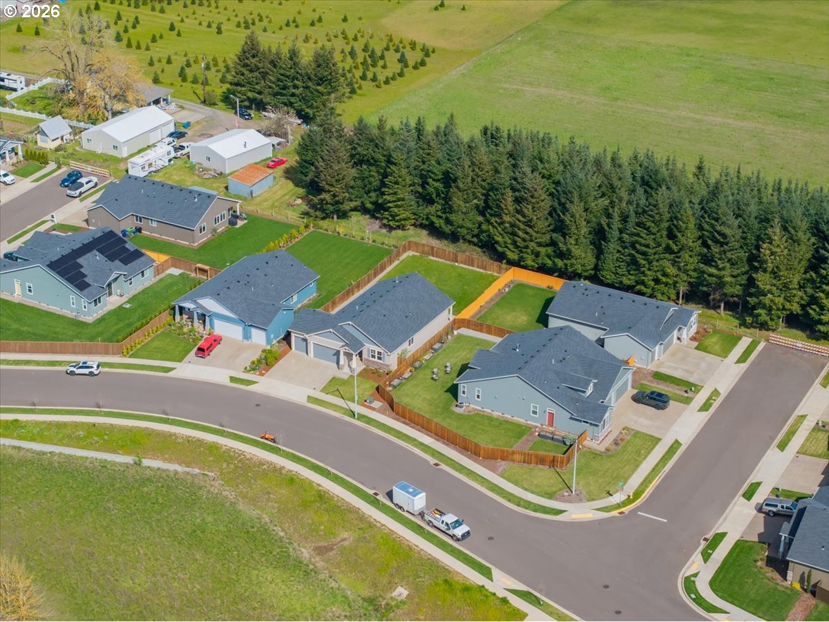 315 Cypress Street Mount Angel, OR 97362 - Photo 4 of 43 an aerial view of residential houses with outdoor space and swimming pool