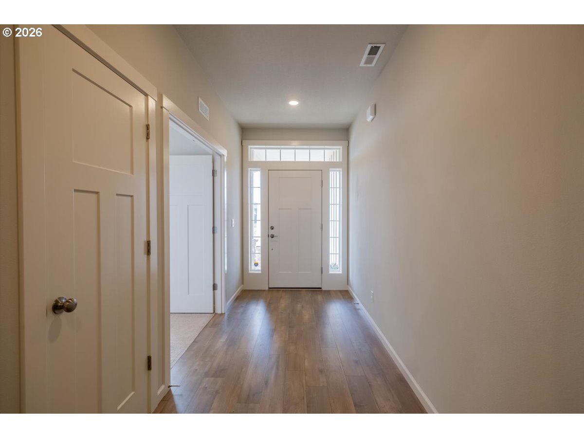 315 Cypress Street Mount Angel, OR 97362 - Photo 8 of 43 a view of a hallway with wooden floor