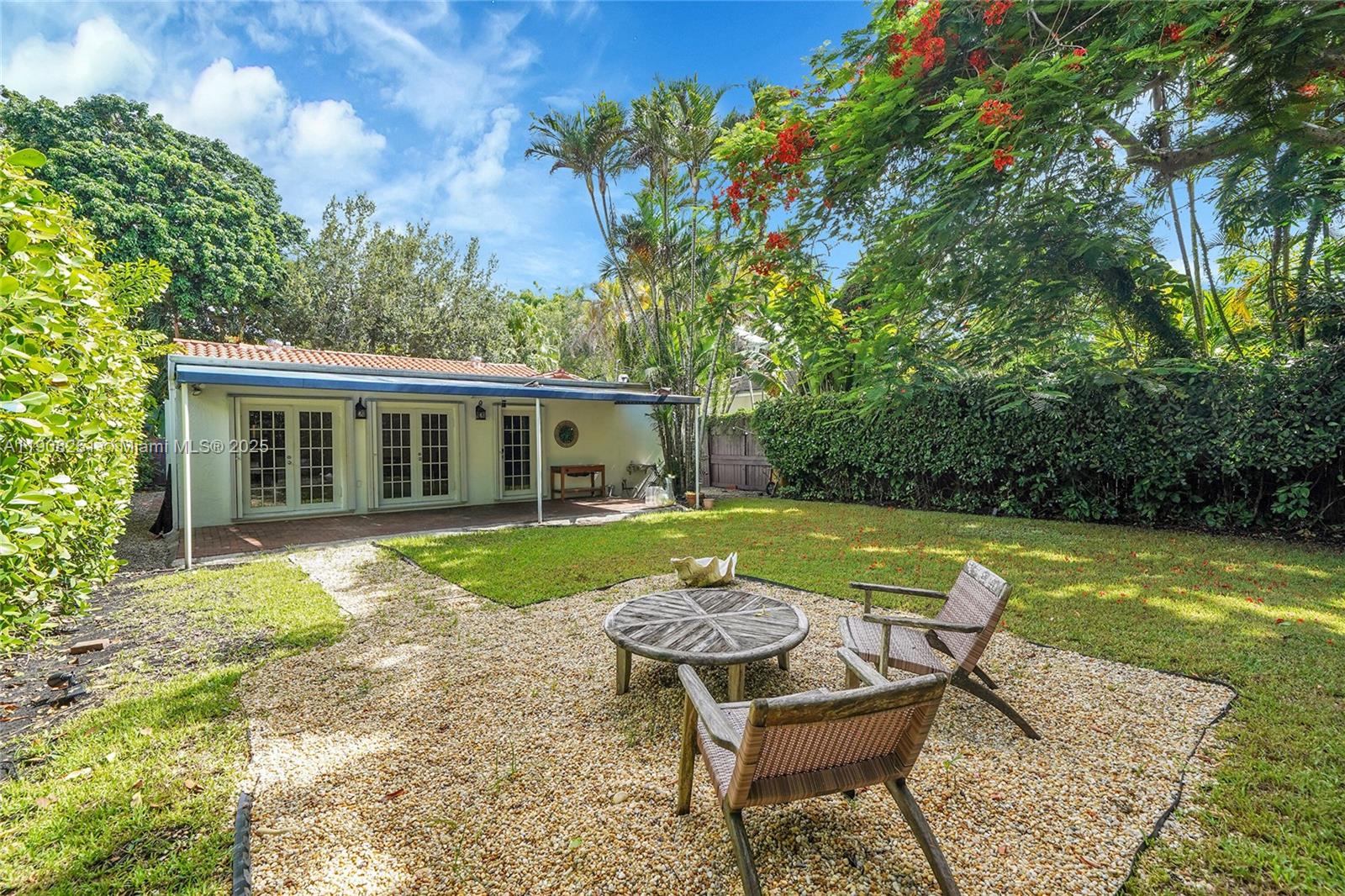 4150 Ventura Avenue Miami, FL 33133 - Photo 23 of 23 a view of a house with swimming pool and a yard