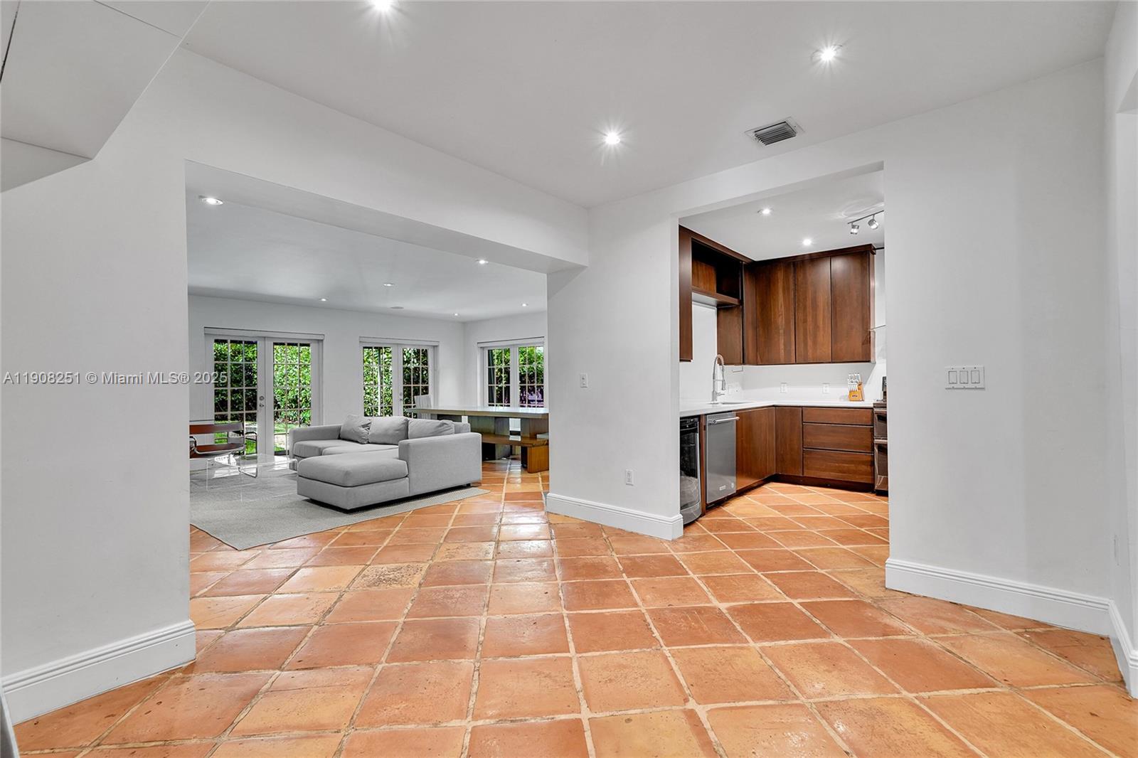4150 Ventura Avenue Miami, FL 33133 - Photo 5 of 23 a living room with furniture and a fireplace