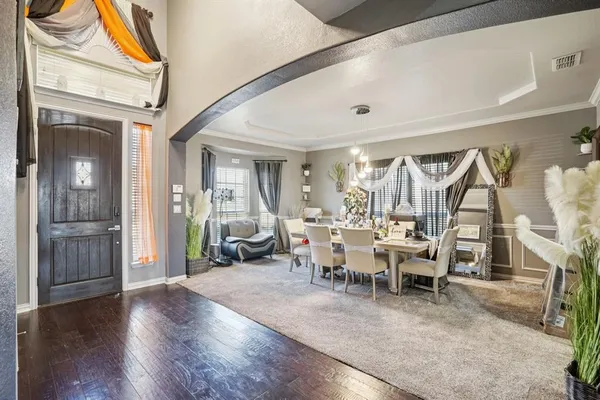 a view of a livingroom with furniture and wooden floor
