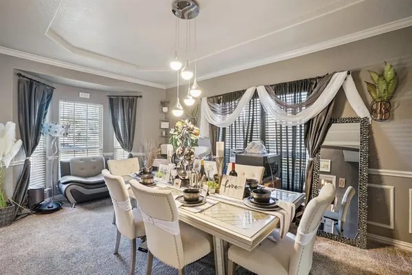 a view of a dining room with furniture window and outside view