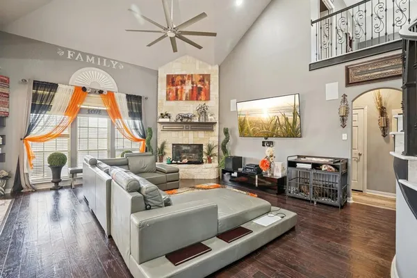 a living room with furniture and a fireplace