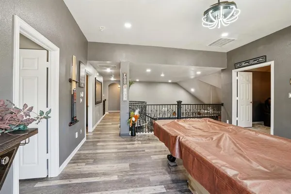 a bed room with a bed and a chandelier