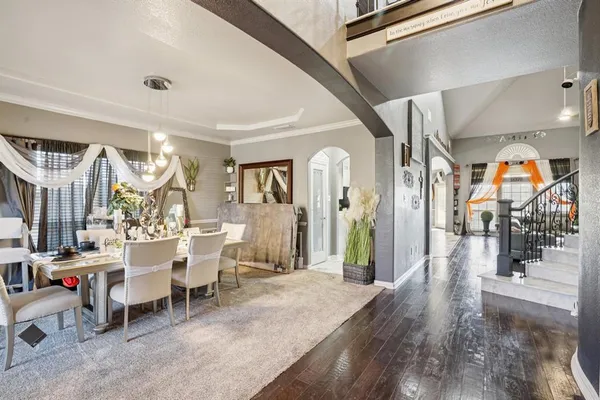 a living room with lots of furniture and painting on the wall