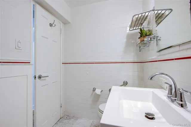 a bathroom with a sink and mirror