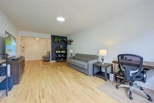 a bed room with a bed and a television