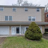 a brick house with a large windows