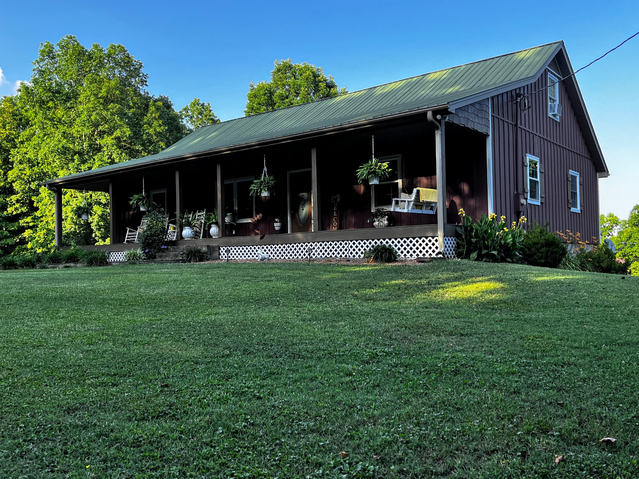 6713 Pilot Lane Lyles, TN 37098 - Photo 2 of 20 a front view of a house with garden and porch