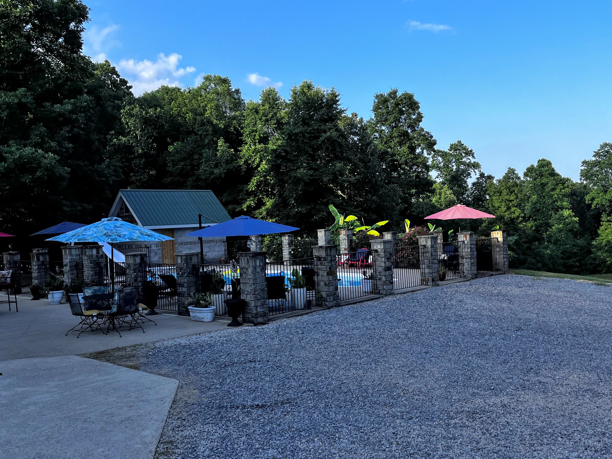 6713 Pilot Lane Lyles, TN 37098 - Photo 6 of 20 a group of people sitting under an umbrella in front of retail shops