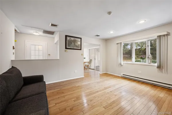 a view of livingroom with hardwood floor and window