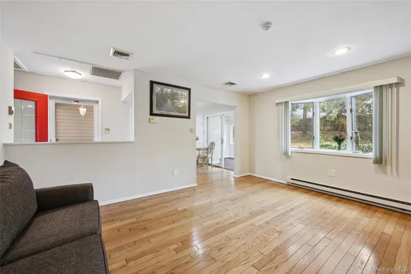 a view of livingroom with hardwood floor and window