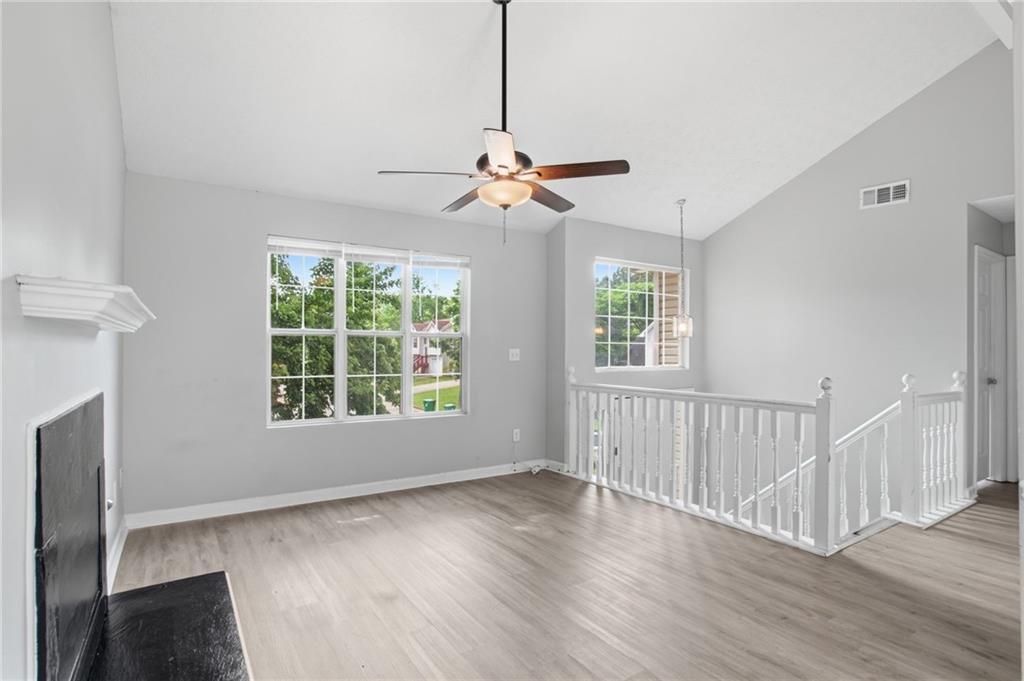 5855 Crescent Ridge Court Lithonia, GA 30058 - Photo 12 of 46 a view of an empty room with wooden floor and a window