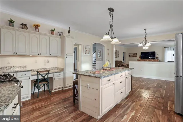 a bed room with a bed and a chandelier