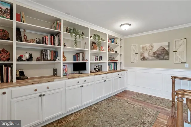 a bathroom with a granite countertop toilet sink and mirror