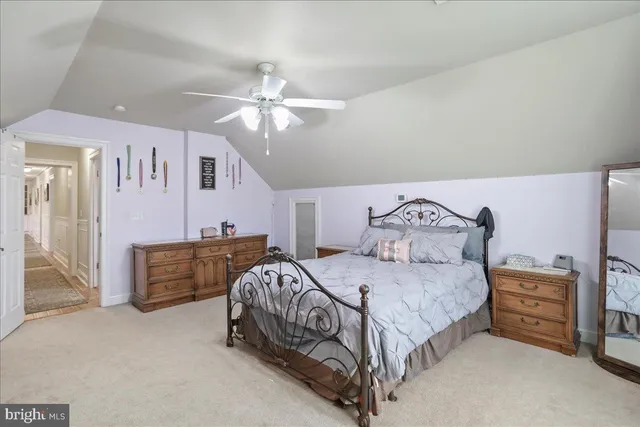 an aerial view of a house with outdoor space lake view and mountain view
