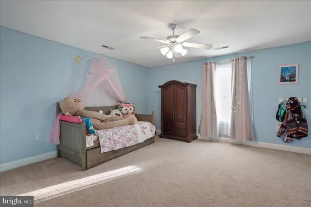 a view of a garden with a building in the background