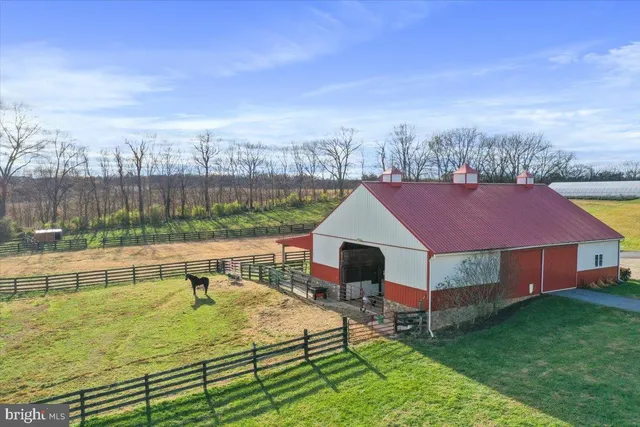 a view of a hallway with wooden floor and entryway