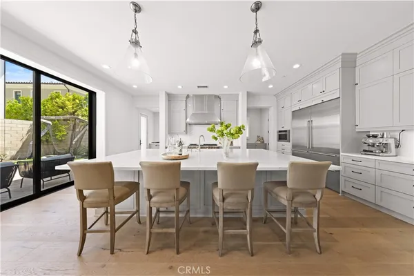 a dining room with furniture a window and a kitchen view