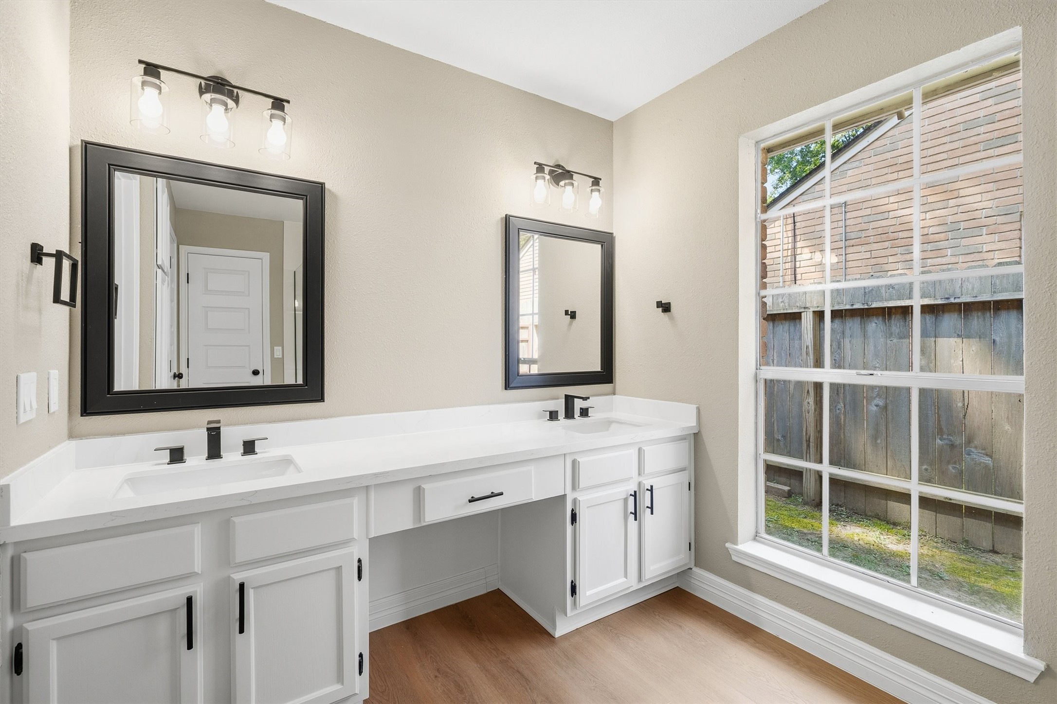 3 Still Corner Place Spring, TX 77381 - Photo 17 of 34 The primary bath is designed for comfort, with dual vanities, quartz counters, and a large window bringing in soft natural light.