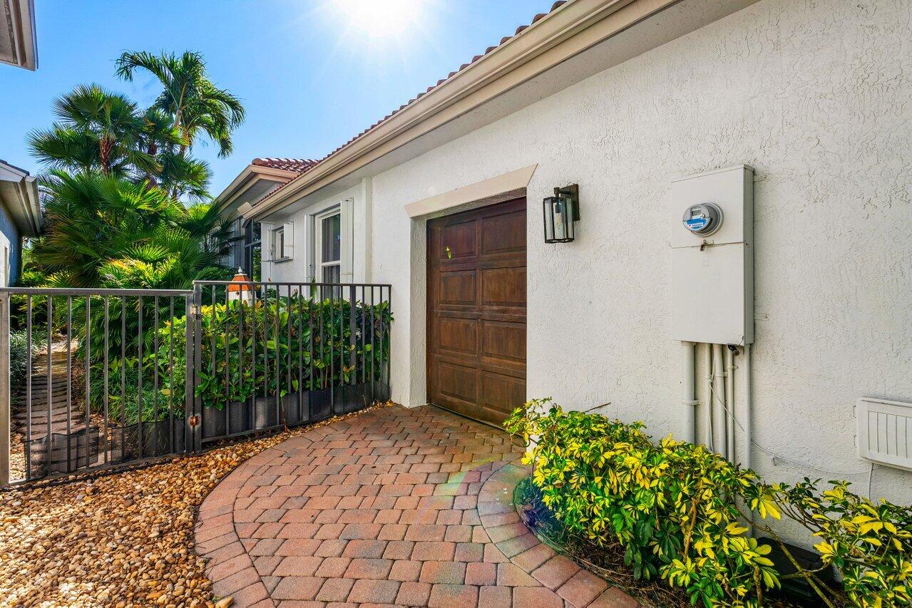 15992 Double Eagle Trail Delray Beach, FL 33446 - Photo 32 of 70 GOLF CART GARAGE ENTRANCE