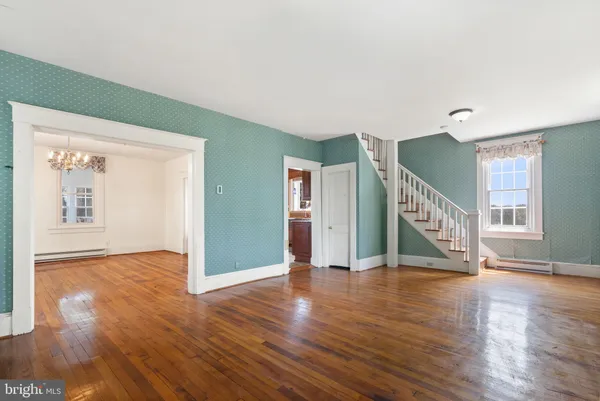 a view of an entryway with wooden floor