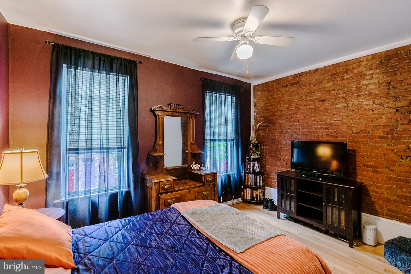 620 South 3rd Street, Unit 2 Philadelphia, PA 19147 - Photo 7 of 10 a bedroom with a bed and a television